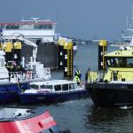 Crews from the police, fire department, and Rijkswaterstaat take part in a search operation in the Afrikahaven in Amsterdam's Westelijke Havengebied, where two workers went missing. 27 October 2025.