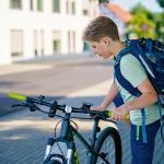 A boy arrived at school on a bicycle