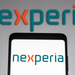 Nexperia logo seen displayed on a smartphone and on the background