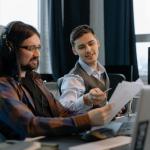 Two men working side-by-side on a project in 2021
