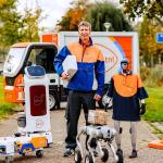A PostNL delivery driver with the robots that have been tested for future use, October 21, 2025.