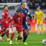 Oranje captain Virgil van Dijk and Poland striker Robert Lewandowski battle for the ball during the FIFA World Cup qualifier in Warsaw, November 14, 2025. 