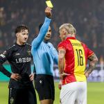 Referee Mohammed Al-Hakim shows a yellow card to Victor Edvardsen of Go Ahead Eagles and Angelo Stiller of VfB Stuttgart during the Dutch Eredivisie match between Go Ahead Eagles and VfB Stuttgart at Stadion De Adelaarshorst on November 27, 2025 in Deventer, Netherlands.