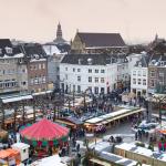 Beautiful view on the city of Maastricht, with a Christmas market on the square on a snowy winter's day