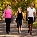 People exercise in a park on an autumn day