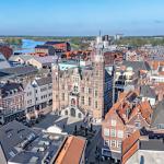 Aerial view of Venlo city center, historic town hall, and the Meuse River, Netherlands.