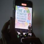 A visitor snaps a photo during a presentation by Startupbootcamp at the accelerator’s Impact Day 2022 event in Amsterdam. June 2022