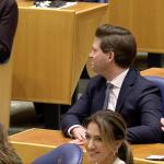 Thom van Campen (VVD) behind his smiling party leader, Dilan Yesilgöz, after his election as the new Chair of the Tweede Kamer. 18 Nov. 2025