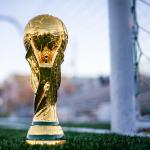 The World Cup trophy on a football pitch. Undated
