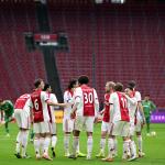 Ajax players celebrate the 1-0 goal during the remainder of the Dutch Eredivisie match between AFC Ajax and FC Groningen, played without spectators, at the Johan Cruijff ArenA on December 2, 2025, in Amsterdam, Netherlands. The match was abandoned after fans set off fireworks twice.