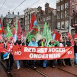 Students and university staff march in Amsterdam carrying a banner reading “Red het hoger onderwijs” to demand better education policies. December 9, 2025