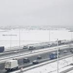 Traffic runs slow and smooth along the A4 motorway, with a ground stop in effect at a snowy Schiphol Airport in the background. 5 Jan. 2026