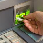 Inserting a bank card.