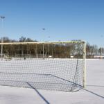 Snow-covered amateur football field in the Netherlands