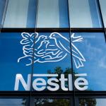 Issy-les-Moulineaux, France - May 18, 2024: Sign and logo on the French headquarters building of Nestl. Nestl is a Swiss multinational food and drink processing conglomerate corporation