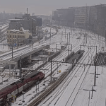 A Eurostar train waits on a snowy platform at Amsterdam Centraal Station. 7 Jan. 2026