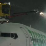 A deicing crew working on a Transavia aircraft at Schiphol Airport in 2025