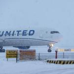 A United Airlines flight on a snowy day at Schiphol Airport. 5 Jan. 2026