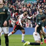 Oussama Targhalline of Feyenoord looks dejected as Ismael Saibari of PSV Eindhoven celebrates the 3–0 during the Dutch Eredivisie match between PSV and Feyenoord at the Philips Stadion on February 1, 2026, in Eindhoven, the Netherlands.