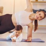 A woman and her baby during a pilates class.