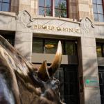 Amsterdam Stock Exchange (AEX) Entrance with Bull statue on foreground showing Beursplein 5 above the doors