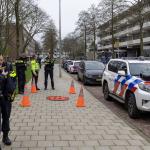 Police stand outside the Cheider Jewish School on Zeelandstraat in the Buitenveldert district after an overnight explosion damaged an exterior wall of the Orthodox Jewish primary and secondary school. March 14, 2026