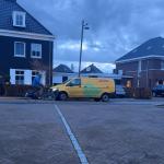 A cyclist passes a DHL delivery vehicle in Doetinchem, Netherlands. March 15, 2026.