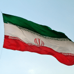Iranian flag flapping in the wind in Tehran, Iran