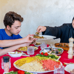 Muslim family eating together