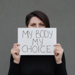 Abortion care: Woman holding a sign reading "My body, my choice."