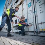 Dutch customs officers opening a container