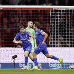 Sondre Ørjasæter and Bart van Rooij of FC Twente celebrate the 1–2 while Ajax goalkeeper Maarten Paes looks on during the Dutch Eredivisie match between AFC Ajax and FC Twente at the Johan Cruijff ArenA on April 4, 2026, in Amsterdam, Netherlands.