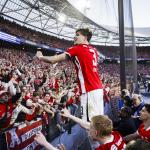 Wouter Goes, Kees Smit and Alexandre Penetra of AZ celebrate the 5–1 victory in the KNVB Cup final between AZ and NEC at De Kuip on April 19, 2026, in Rotterdam, Netherlands.