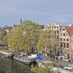 The Westerkerk rising above the treetops looking southwest along the Singel in Amsterdam-Centrum. 28 April 2026