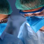 Close-up of two surgeons.