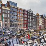 Bikes parked on the Nieuwe Brug in Amsterdam along Prins Hendrikkade, near the Damrak. Feb. 2020