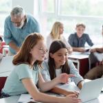 Students use computers in class.