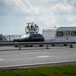 Holidaymaker: A car with bikes on the roof pulls a caravan on a Dutch highway