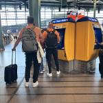 Tourists buying train tickets on King's Day at the Schiphol Airport rail station. 27 April 2026