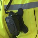 An NS security worker wearing a bodycam