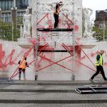 Cleaners cleaning red paint off the National Monument on Dam Square in Amsterdam after vandalism on Remembrance Day, 4 May 2026