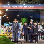 British veteran Robbie Hall, 103, and Dutch veteran Johan Geneuglijk, 105, light the liberation flame alongside Mayor Floor Vermeulen during the liberation fire ceremony in Wageningen, Netherlands. May 4, 2026