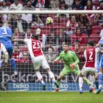 Mike van der Hoorn of FC Utrecht scores the 1-2 goal past AFC Ajax players Wout Weghorst and goalkeeper Maarten Paes during the Dutch Eredivisie match between AFC Ajax and FC Utrecht at the Johan Cruijff ArenA on May 10, 2026, in Amsterdam, the Netherlands.