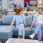 A couple is choosing a couch.