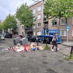 Trash surrounding full bins on an Amsterdam street, 15 May 2026