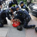 Police detain a person as riot police and a water cannon are deployed in a residential district following Morocco’s World Cup victory over the Netherlands. June 30, 2026.