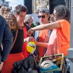 A woman sells laughing gas on King's Day in Amsterdam in 2018.