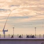 Group of schoolchildren cycling on a bridge in Nijmegen. 12 Nov. 2025
