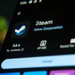 Steam app icon on Google Play Store on a tablet with a laptop keyboard as a background