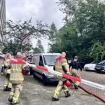 Firefighters by an apartment block in Amsterdam Nieuw-West hours after a severe explosion, June 12, 2026.
